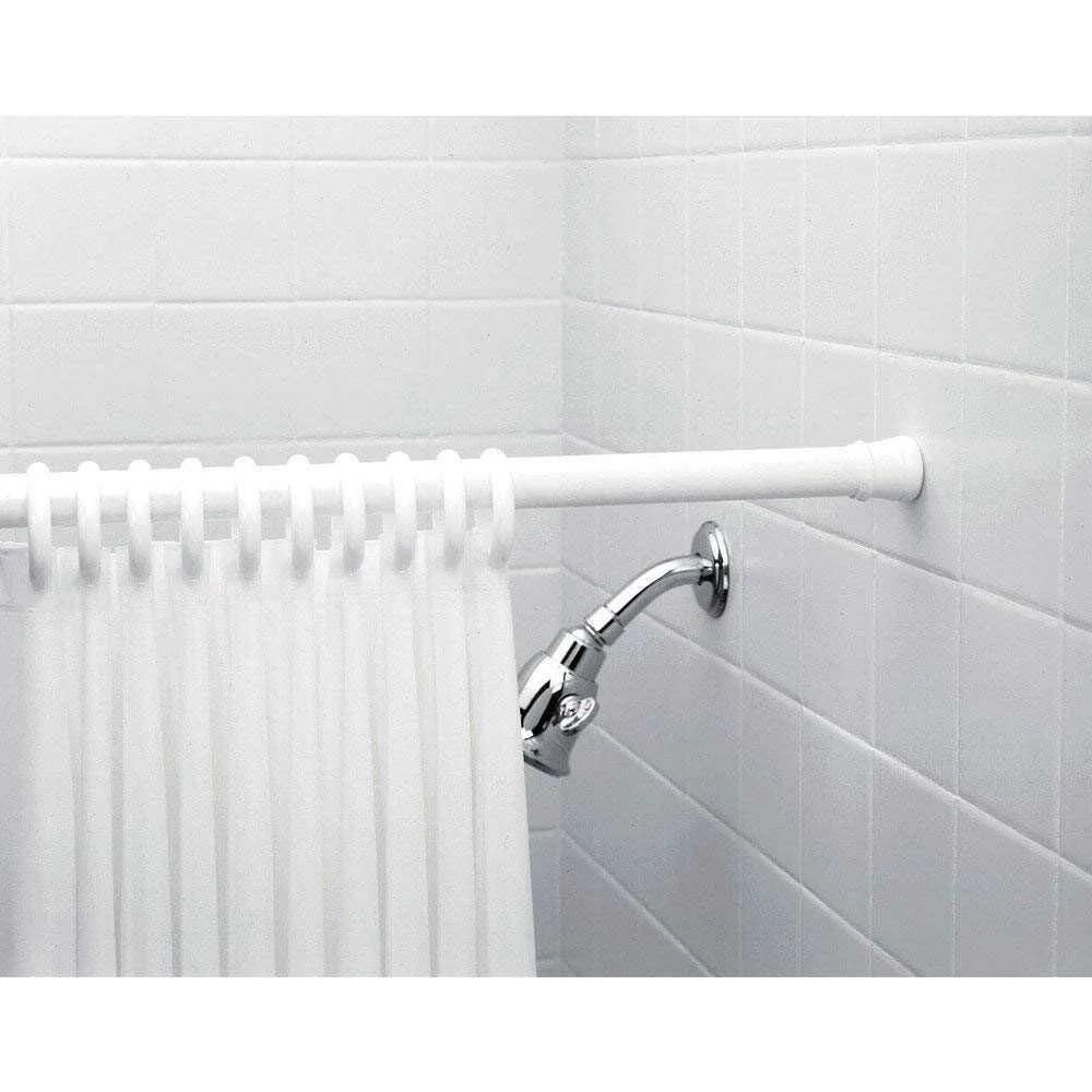 Bathroom grab bar attached to a tiled wall with a white shower curtain.